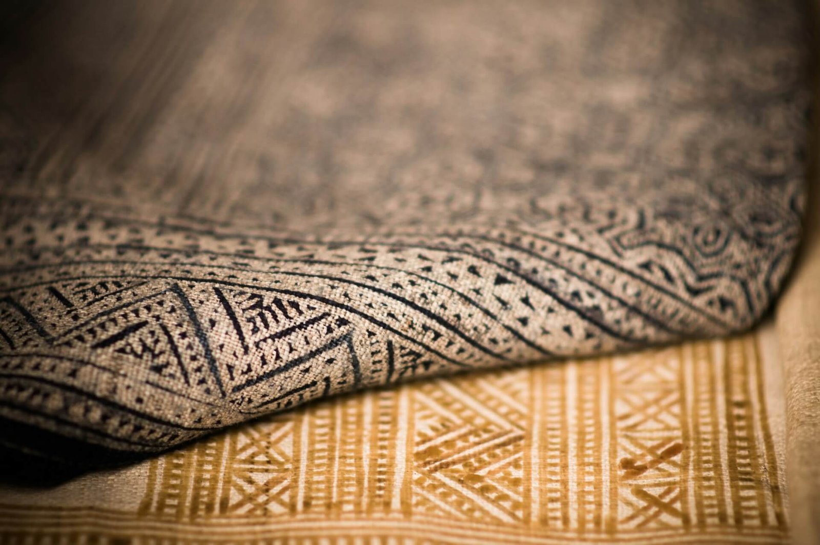 close-up of two beige rugs